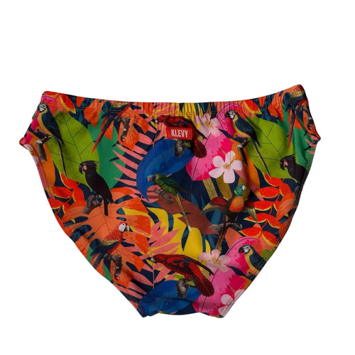 Colorful swim briefs with tropical leaf and parrot pattern on a white background